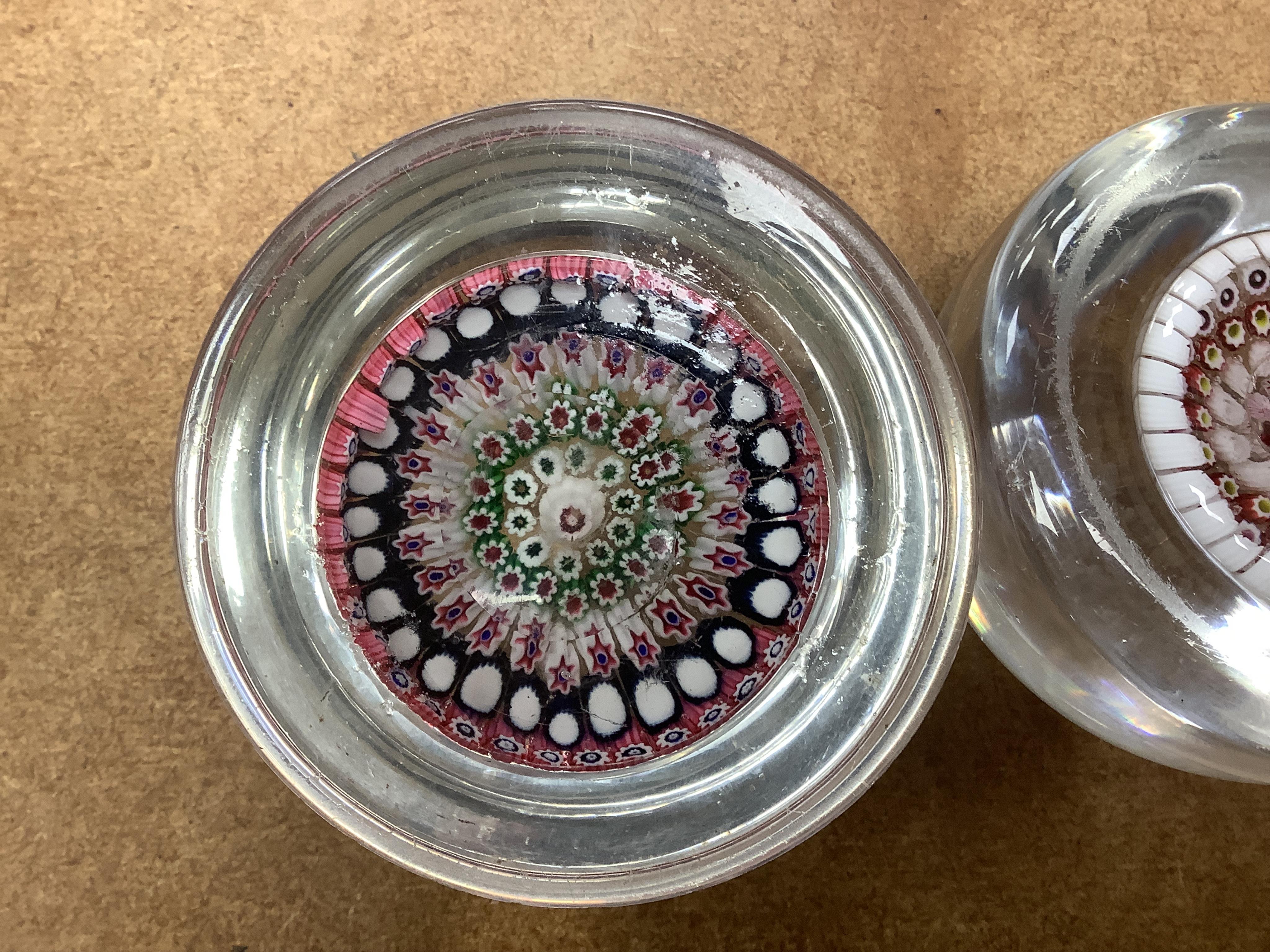 Two Victorian English millefiori glass paperweights, 7cm tall. Condition - fair to good